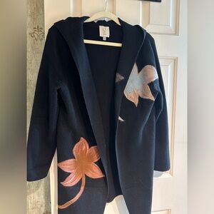 Worn once or twice….unique black sweater/jacket with floral embellishments